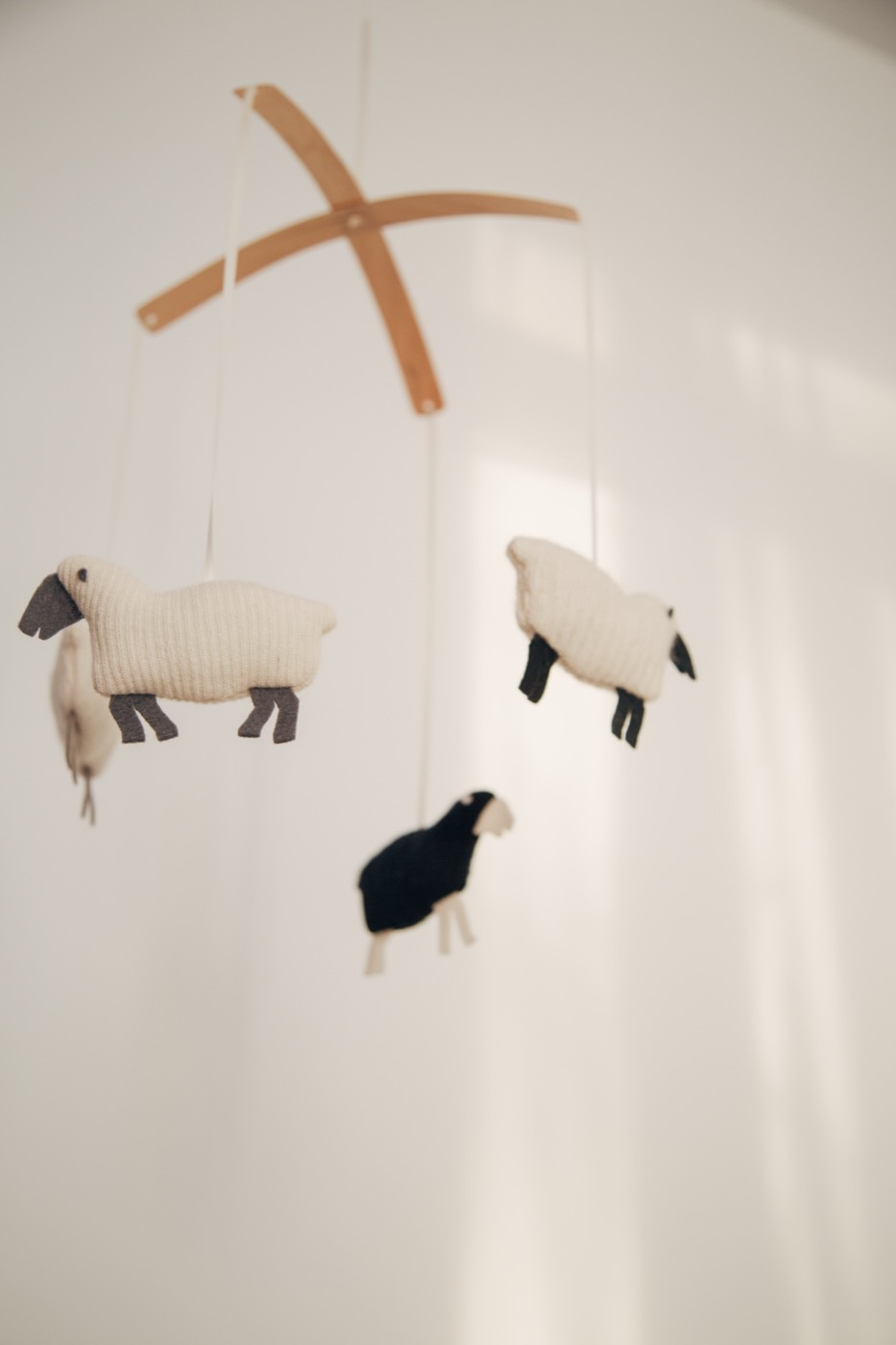 Knitted sheep mobile in the nursery