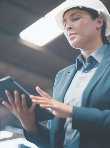 Engineer reviewing plans on a tablet